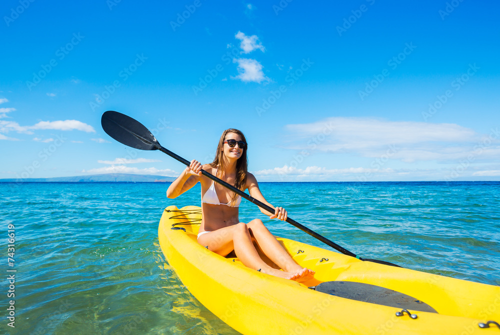 Woman Kayaking in the Ocean on Vacation