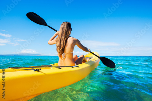 Vászonkép Woman Kayaking in the Ocean on Vacation