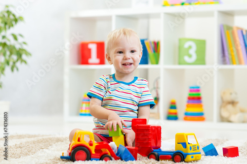 kid toddler playing with to...