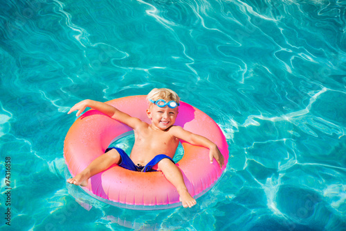 Young Kid Having Fun in Swimming Pool