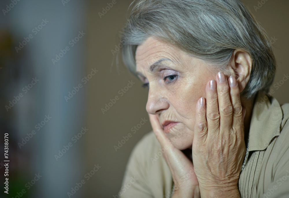 Fototapeta premium Sad aged woman