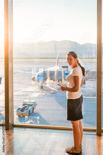 happy girl at the airport waiting for departure home photo