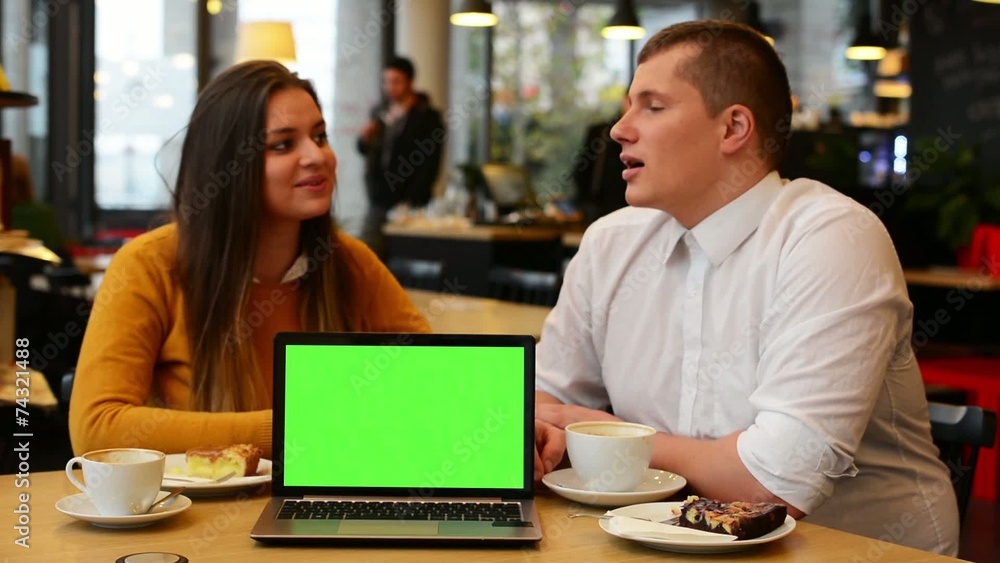 happy couple talk in cafe - computer (notebook) green screen happy couple talk in cafe - computer (notebook) green screen