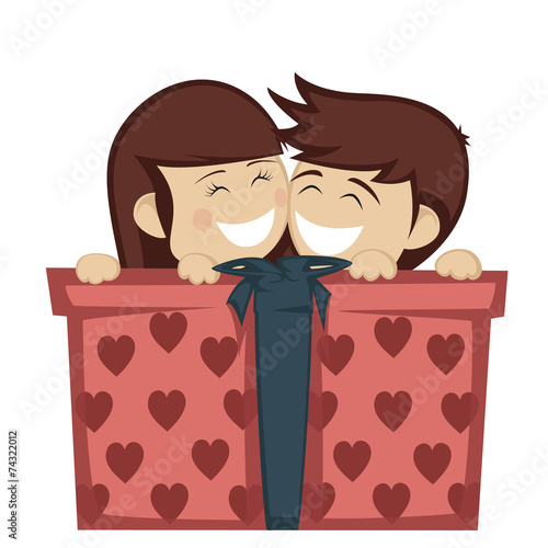 Big box surprise - Girl and boy huddling behind a big gift box.