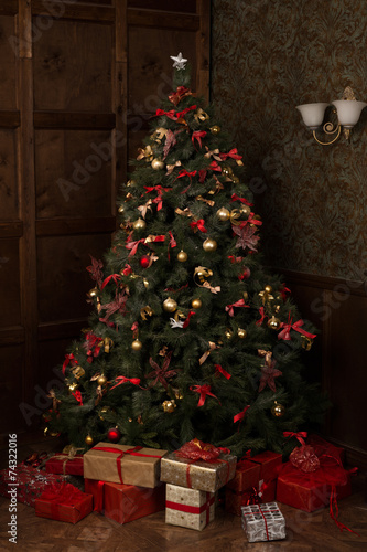 Beautifully decorated Christmas tree with many presents under it