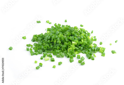 chopped fresh green onions isolated on white