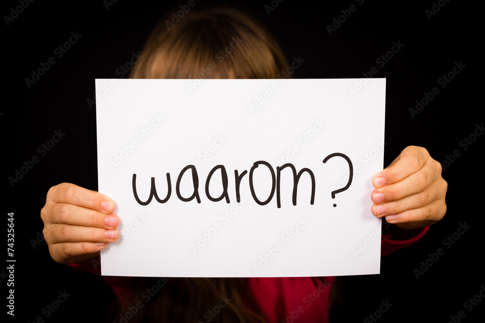 Child holding sign with Dutch word Waarum - Why Child holding sign with Dutch word Waarum - Why