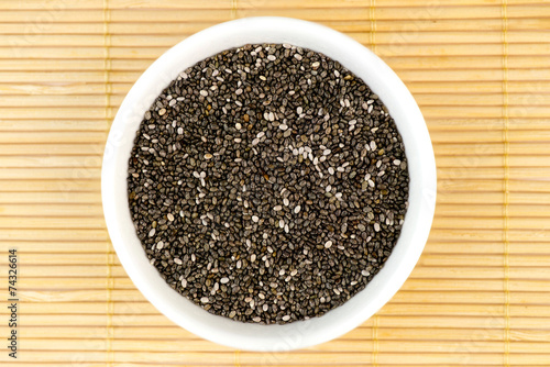 Aerial closeup of chia seeds on bamboo mat