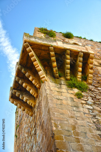 Historic centre of Caceres: cantilevered structure at the top of a fortified tower, to observe and harass the enemy (called in spanish ‘matacán’) photo