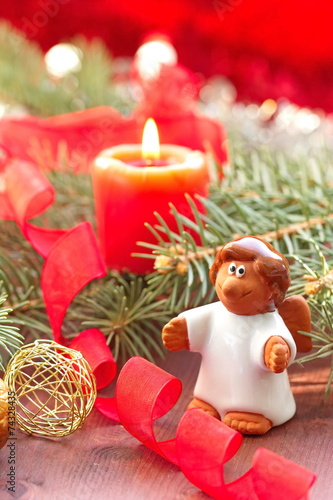 Small angel with christmas decoration