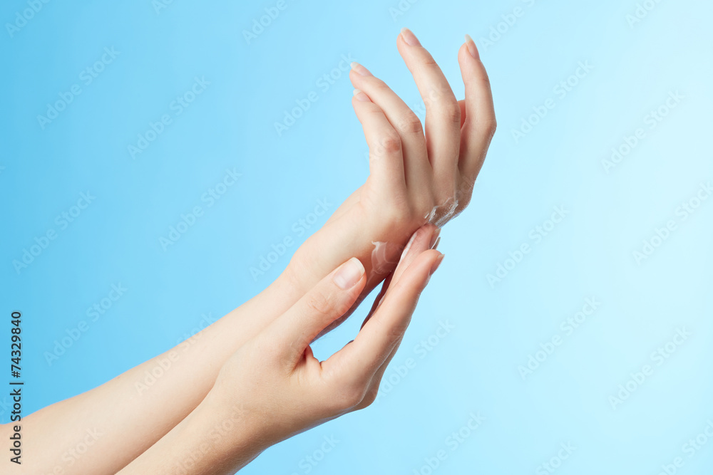 Woman's hands in moisturizer cream Woman's hands in moisturizer cream