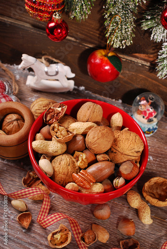nuts assortment in bowl on wooden table for christmas