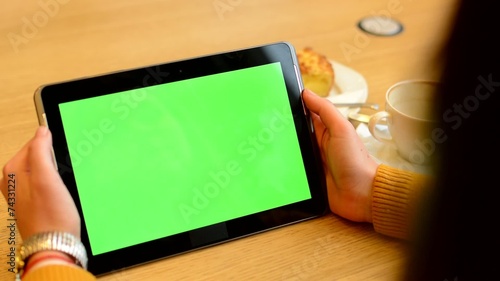 woman works on tablet green screen in cafe - coffee and cake