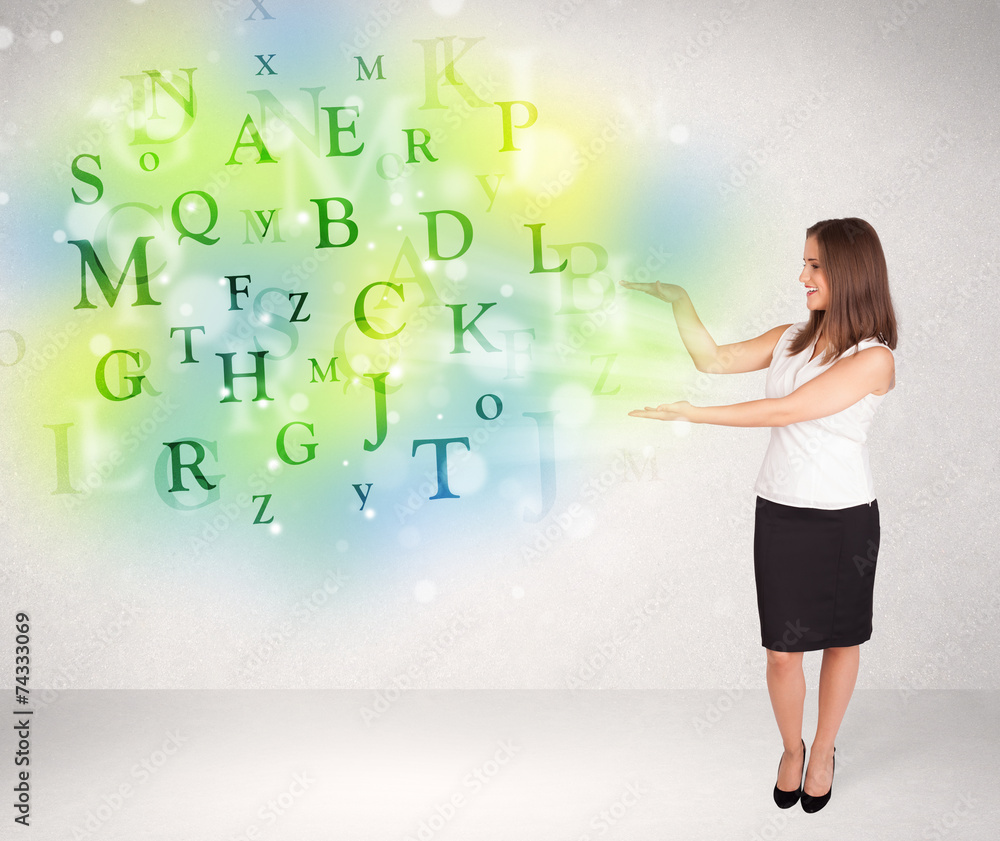 Business women with glowing letter concept Business women with glowing letter concept
