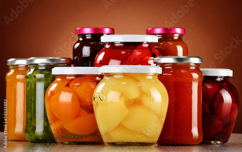 Jars with fruity compotes and jams. Preserved fruits