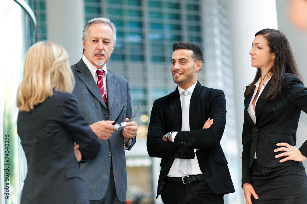Group of business people discussing Group of business people discussing