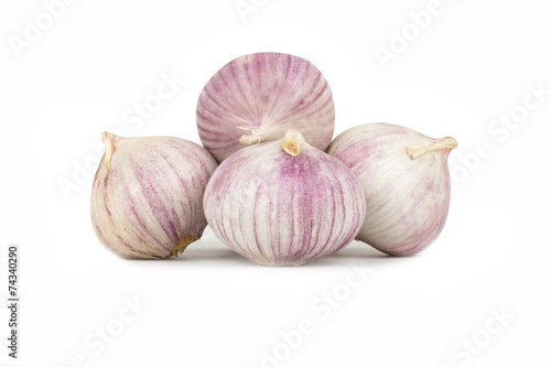 several heads of garlic on a white background