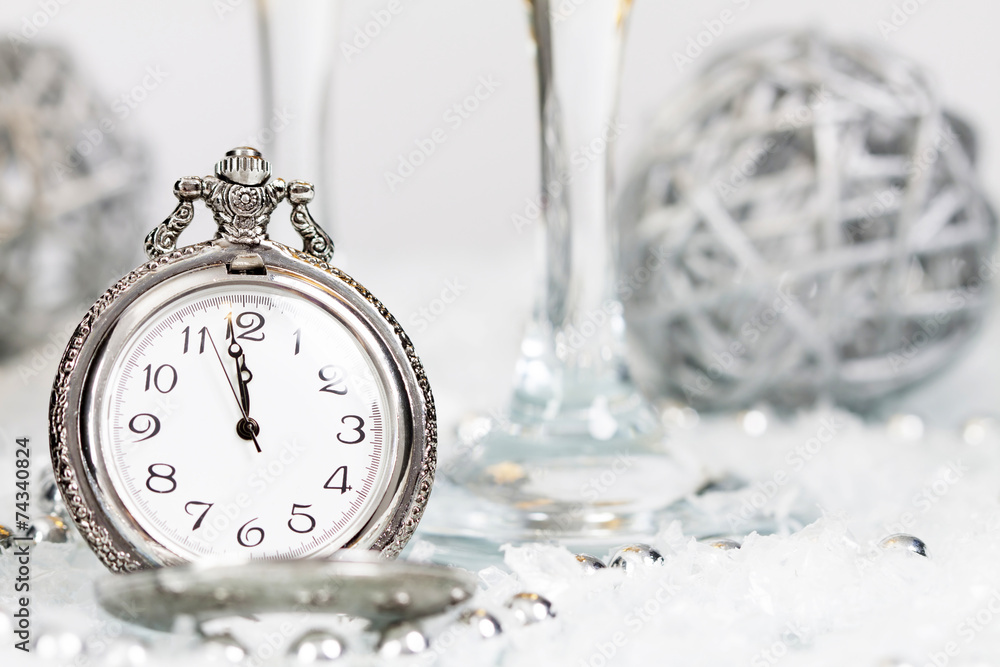 Old silver clock close to midnight and Christmas decorations Old silver clock close to midnight and Christmas decorations