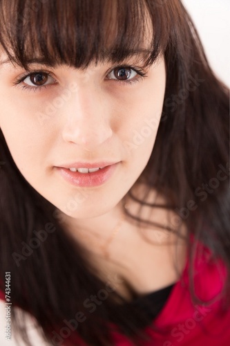 teen girl looks into the camera