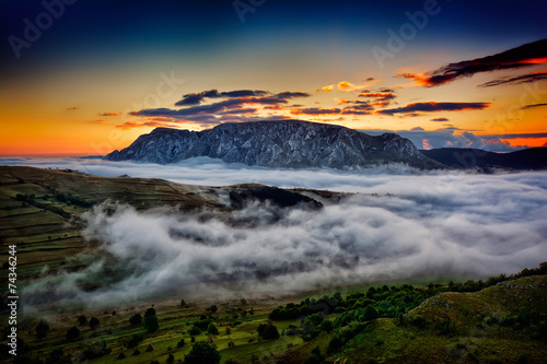 beautiful mountain landscape in foggy morning in Romania