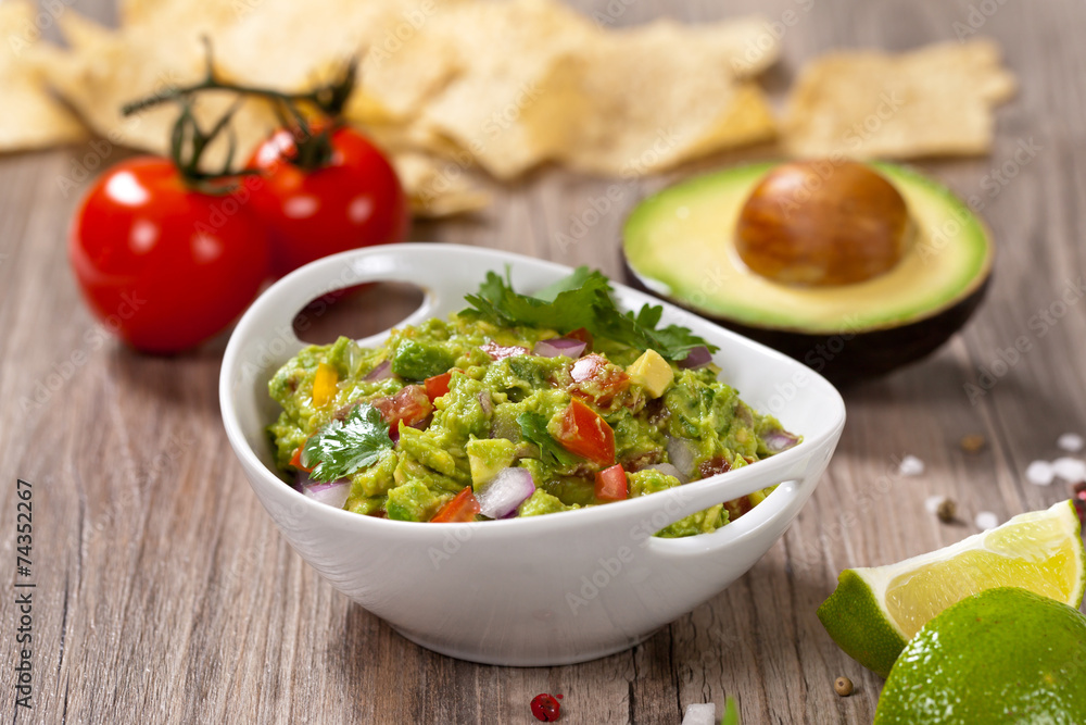 Guacamole with avocado, lime, tomato and cilantro Guacamole with avocado, lime, tomato and cilantro