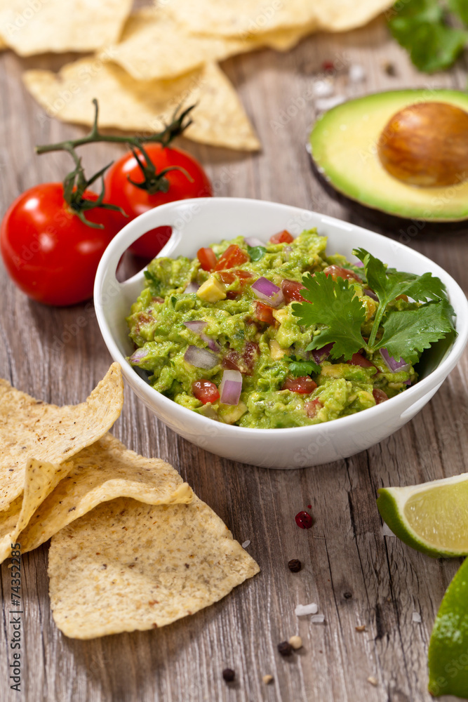 Guacamole with avocado, lime, tomato and cilantro Guacamole with avocado, lime, tomato and cilantro
