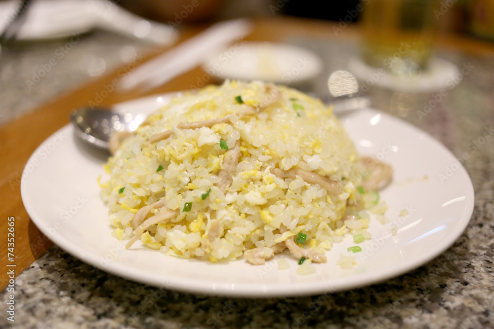 Fried rice on white dish.