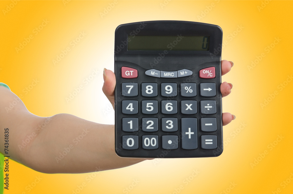 Hand holding calculator on white Hand holding calculator on white