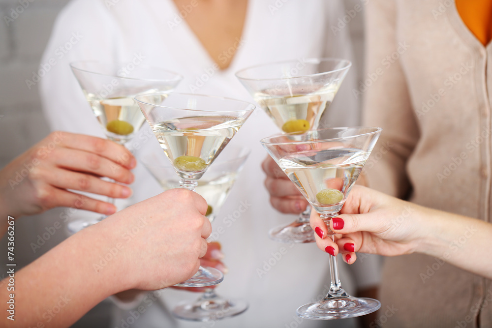 Woman hands with glasses of martini close-up Woman hands with glasses of martini close-up
