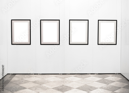 Empty picture frames on the wall in art gallery