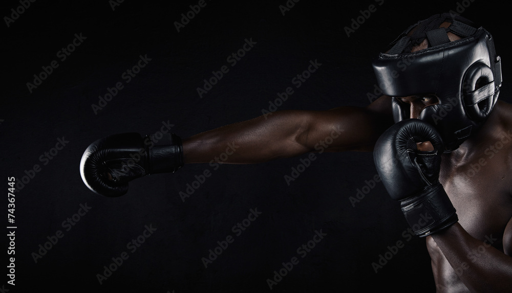 Fotografija Young man practicing boxing