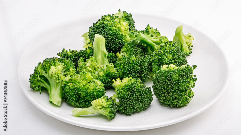 Broccoli on the plate isolated in white. Broccoli on the plate isolated in white.
