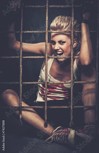 Troubled teenager girl behind bars