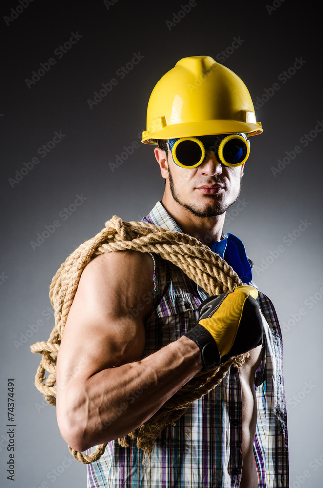 Fototapeta premium Ripped muscular builder man with tools