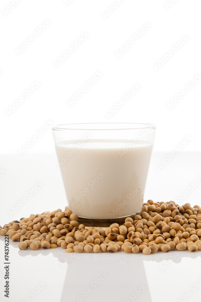 Soy milk in glass with soybeans Soy milk in glass with soybeans