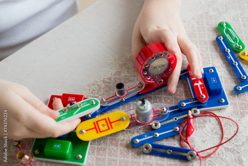 Teen boy at home with electronic project Teen boy at home with electronic project