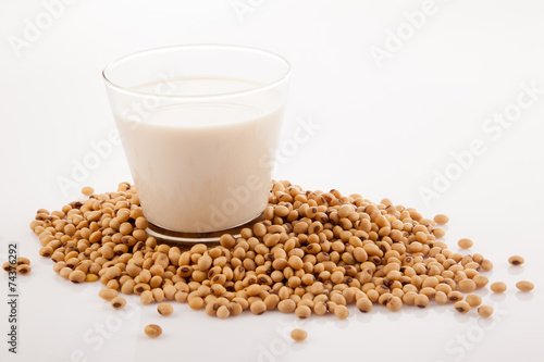 Soy milk in glass with soybeans