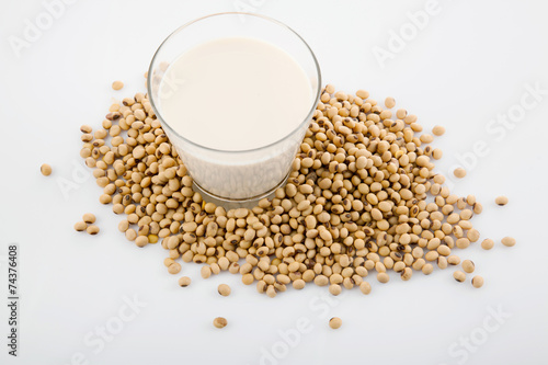 Soy milk in glass with soybeans