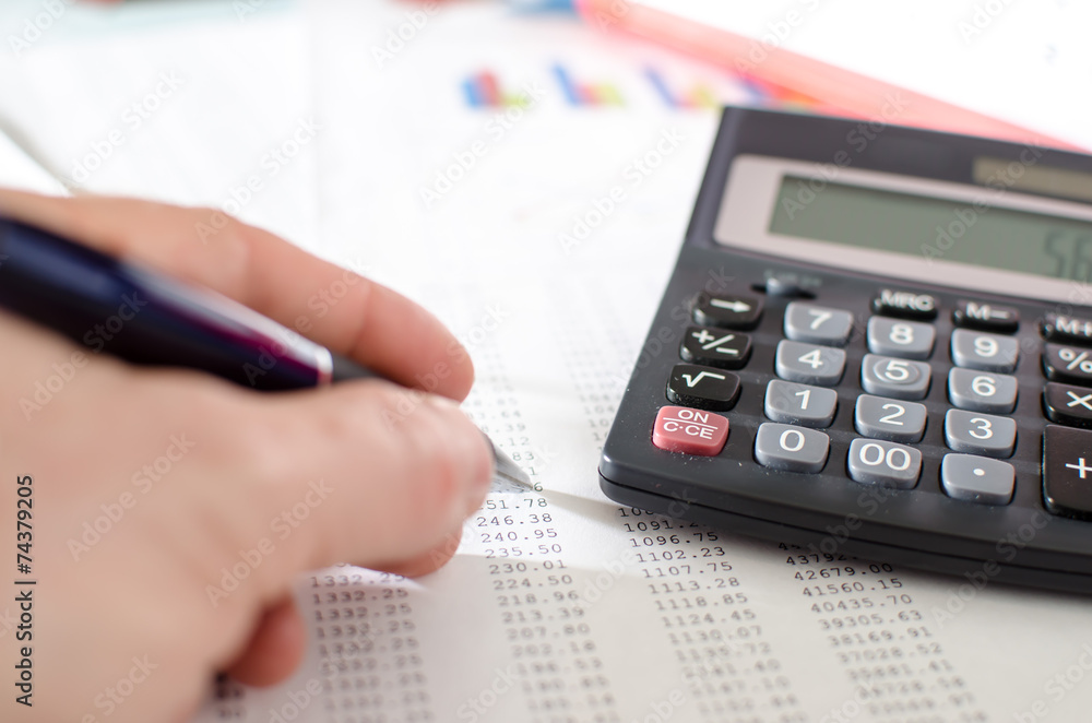 Businesswoman checking financial documents Businesswoman checking financial documents