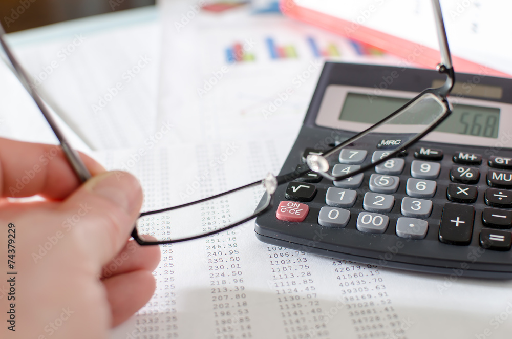 Businesswoman checking financial documents Businesswoman checking financial documents