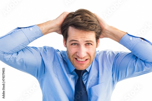 Stressed businessman with hands on head