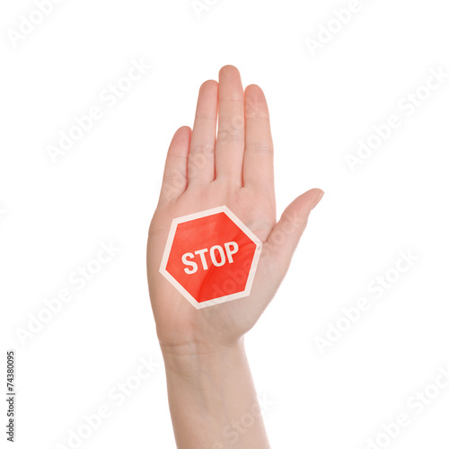 Hand making Stop sign on white background