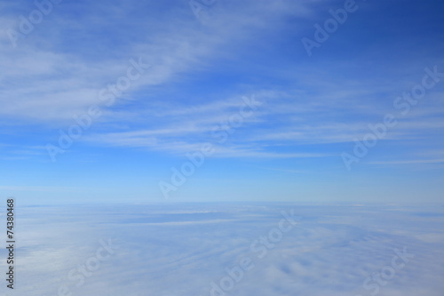 Blue sky over the surface of white clouds, aerial photography