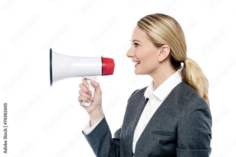 Business woman proclaiming into megaphone Business woman proclaiming into megaphone