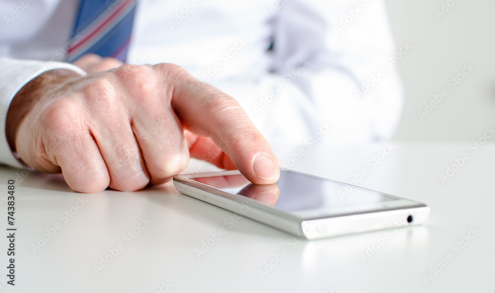 Businessman using a smartphone Businessman using a smartphone