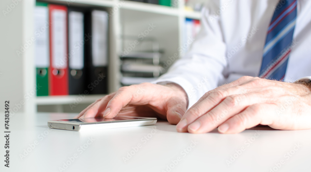 Businessman using a smartphone Businessman using a smartphone