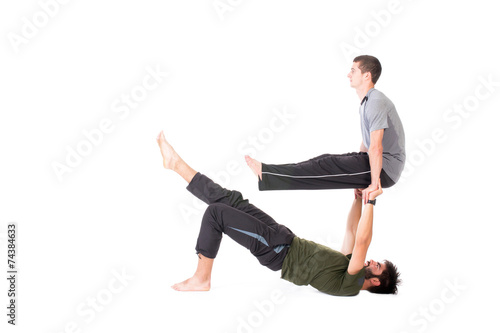 Men in Acro Yoga pose