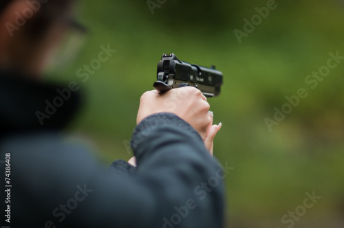 Woman holding a gun