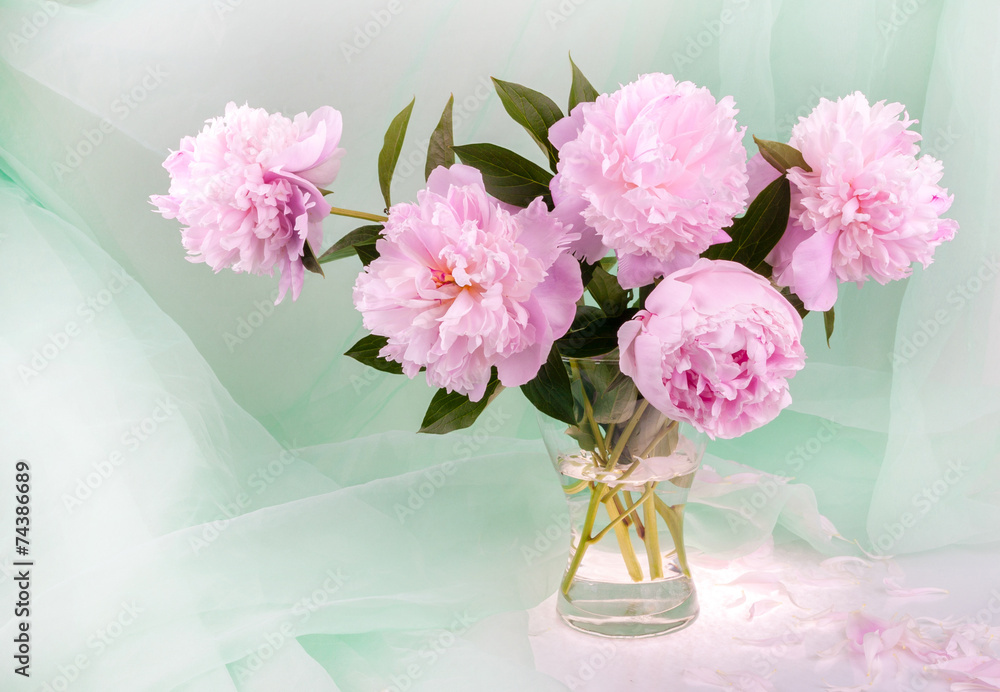 Still life with beautiful pink peonies in a glass vase Still life with beautiful pink peonies in a glass vase