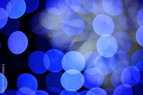 The abstract blue bokeh christmas lights